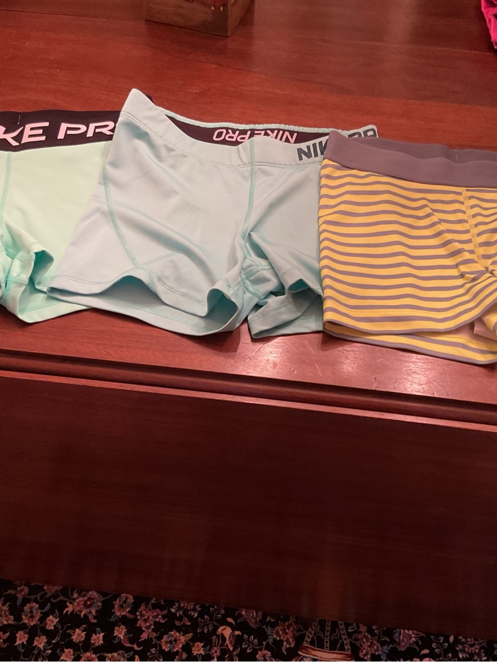 Three Nike Women's Green, Light Blue & Yellow/Grey Striped Athletic Shorts Trio